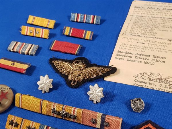 uss belleau wood grouping insignias close up