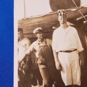 RPPC SAILOR MKII GAS MASK ABOARD SHIP. Very scarce photo of a Navy sailor wearing one of the early MKII variations of the gas mask. Excellent condition with writing of this man's name and wearing the mask on the back. Photoshoto-of-sailor-in-gas-mask-scarce-variation-aboard-ship-1918