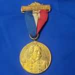 GAR 32nd Encamp 1898 souvenir with Admiral Dewey on Front. This is a excellent medal with the original gilding on the planchet and the top bar, ribbon in good condition and in 1898 they decided to place admiral Dewey on the front