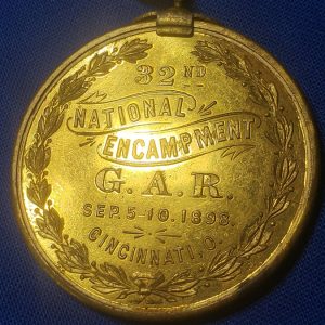 GAR 32nd Encamp 1898 souvenir with Admiral Dewey on Front. This is a excellent medal with the original gilding on the planchet and the top bar, ribbon in good condition and in 1898 they decided to place admiral Dewey on the front