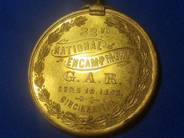 GAR 32nd Encamp 1898 souvenir with Admiral Dewey on Front. This is a excellent medal with the original gilding on the planchet and the top bar, ribbon in good condition and in 1898 they decided to place admiral Dewey on the front