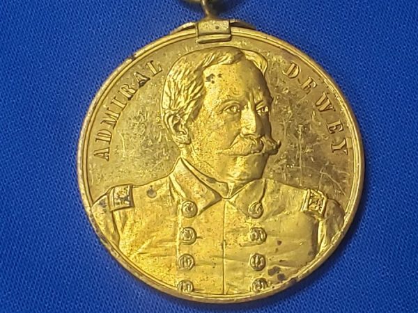 GAR 32nd Encamp 1898 souvenir with Admiral Dewey on Front. This is a excellent medal with the original gilding on the planchet and the top bar, ribbon in good condition and in 1898 they decided to place admiral Dewey on the front