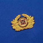 german-vet-visor-wreath-cap-badge-woven-prong