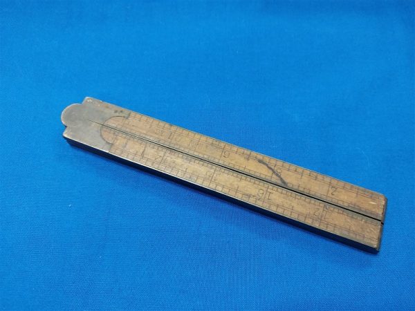 World-war-one-wooden-ruler-with-brass-hinges-used-in-map-cases-and-engineer-kits