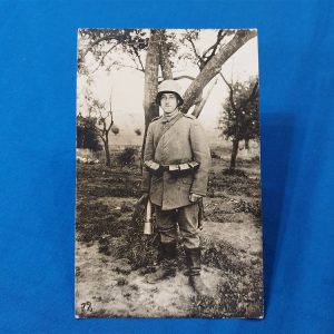 real-picture-post-card-of-german-soldier-in-the-field-with-potato-masher-gear-rifle