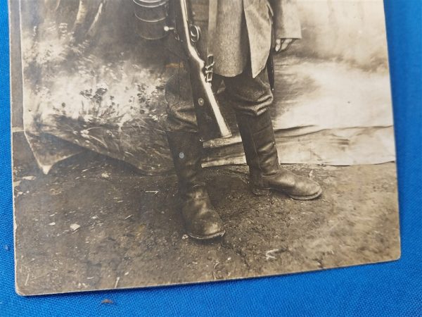 world-war-one-german-real-picture-post-card-soldier-in-field-with-backdrop-rppc