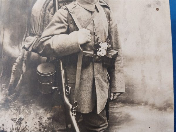 world-war-one-german-real-picture-post-card-soldier-in-field-with-backdrop-rppc