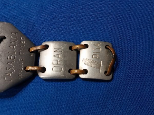 world-war-two-bracelet-made-of-aluminum-named-to-soldier-theater-of-italy-names-of-cities-large-eagle-on-front