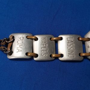 world-war-two-bracelet-made-of-aluminum-named-to-soldier-theater-of-italy-names-of-cities-large-eagle-on-front