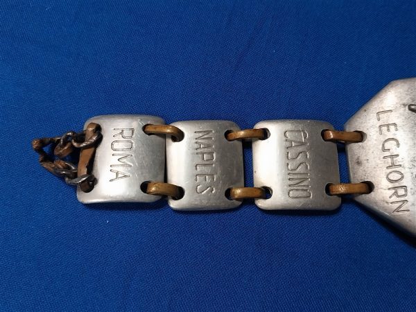 world-war-two-bracelet-made-of-aluminum-named-to-soldier-theater-of-italy-names-of-cities-large-eagle-on-front