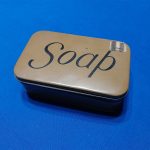 world-war-two-soap-dish-unissued-with-price-tag-of-15-cents-still-on-it-tin-construction-word-soap-on-mustard-yellow-color