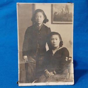 world-war-two-japanese-picture-of-woman-in-naval-uniform-sitted-beside-friend-uniform-has-rank-stripes