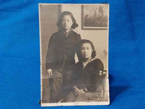 world-war-two-japanese-picture-of-woman-in-naval-uniform-sitted-beside-friend-uniform-has-rank-stripes